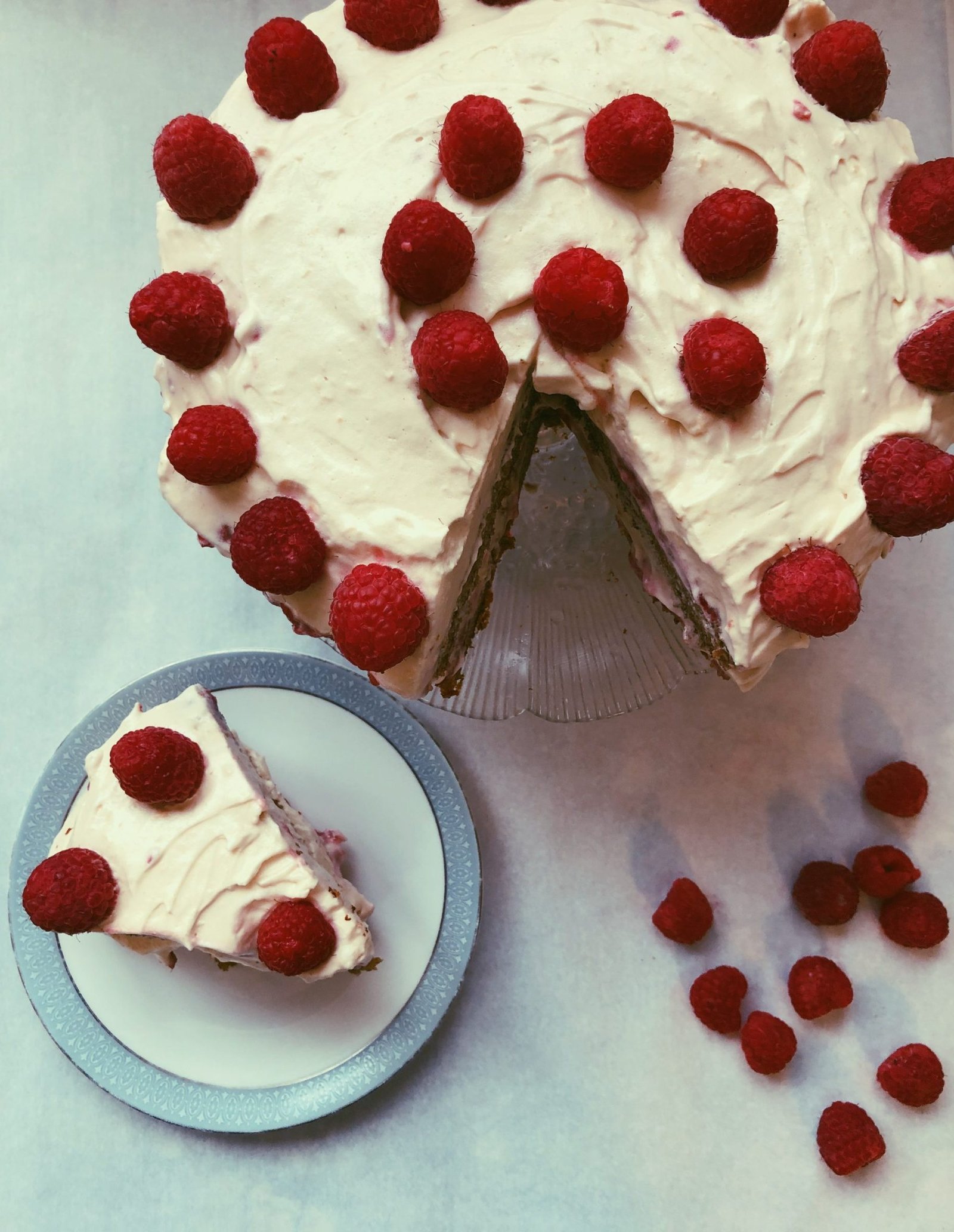 grain free raspberry-infused cake with raspberry jam and honey meringue frosting